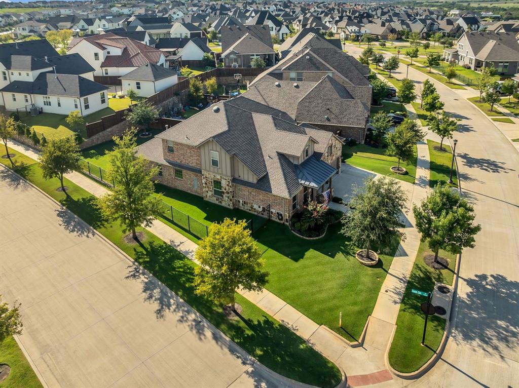 1920 Crescent Street Fort Worth, TX 76008 - Photo 40 of 40 an aerial view of a house with a yard and lake view