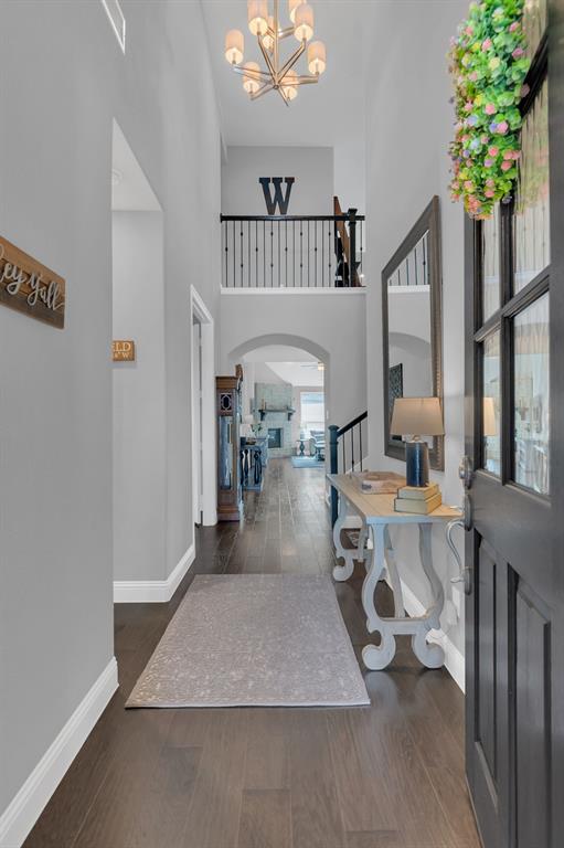1920 Crescent Street Fort Worth, TX 76008 - Photo 4 of 40 a living room with furniture and a chandelier
