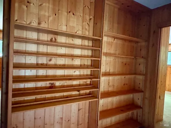 a view of a room with racks on the wall
