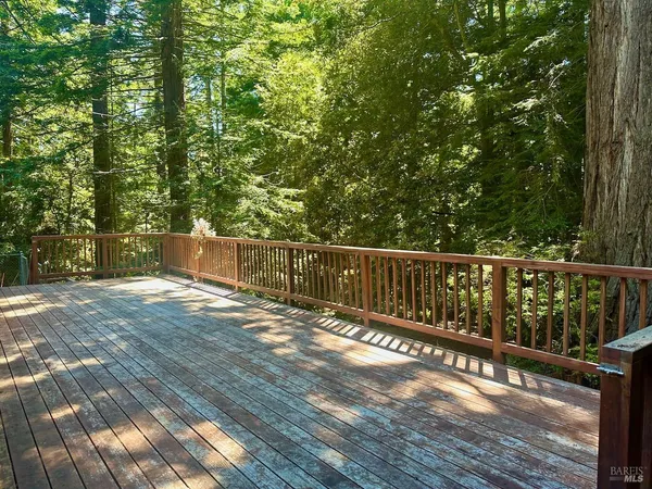 a view of balcony with wooden floor
