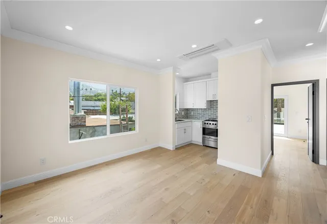 a view of a kitchen with a sink and a window