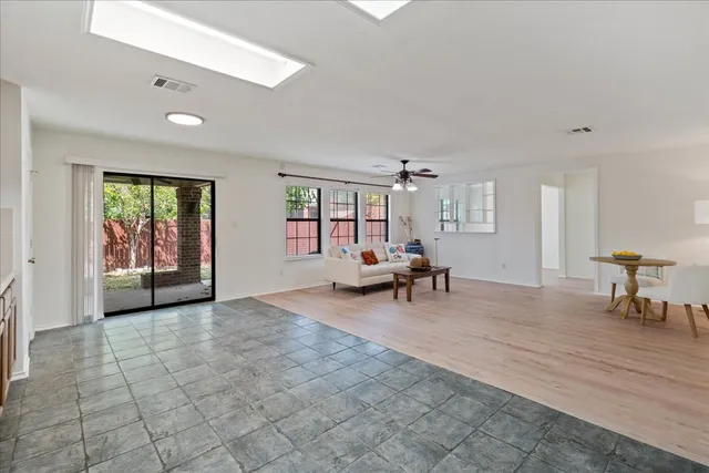 a view of a livingroom with furniture and a rug