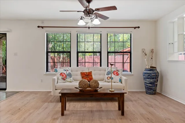 a living room with furniture and window