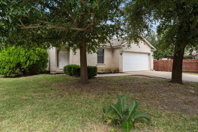 a house with trees in front of it