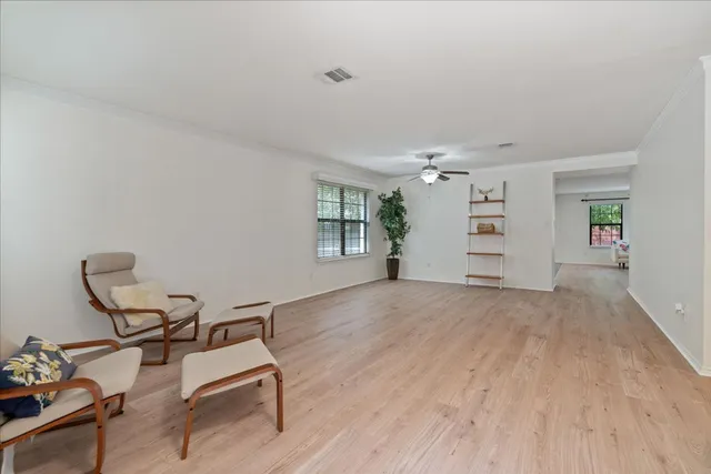 a view of a livingroom with furniture and a window
