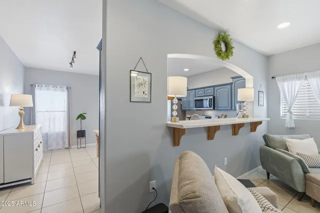 a view of a dining room that has a table and chairs in it