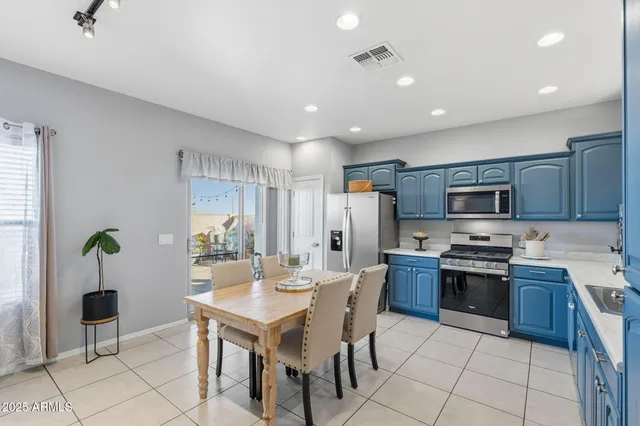 a bathroom with a tub double sink window and mirror