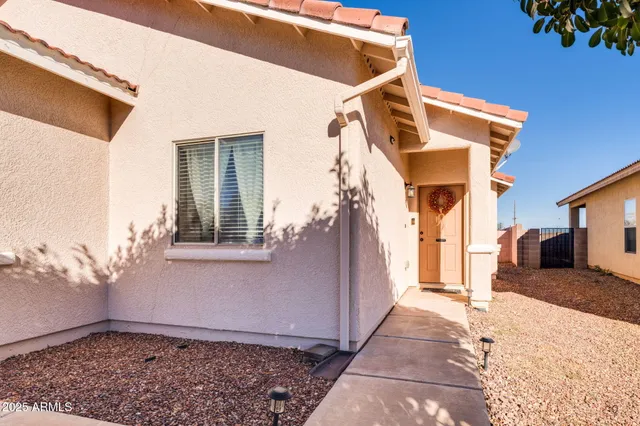 a kitchen with stainless steel appliances granite countertop a sink a stove a dining table and chairs