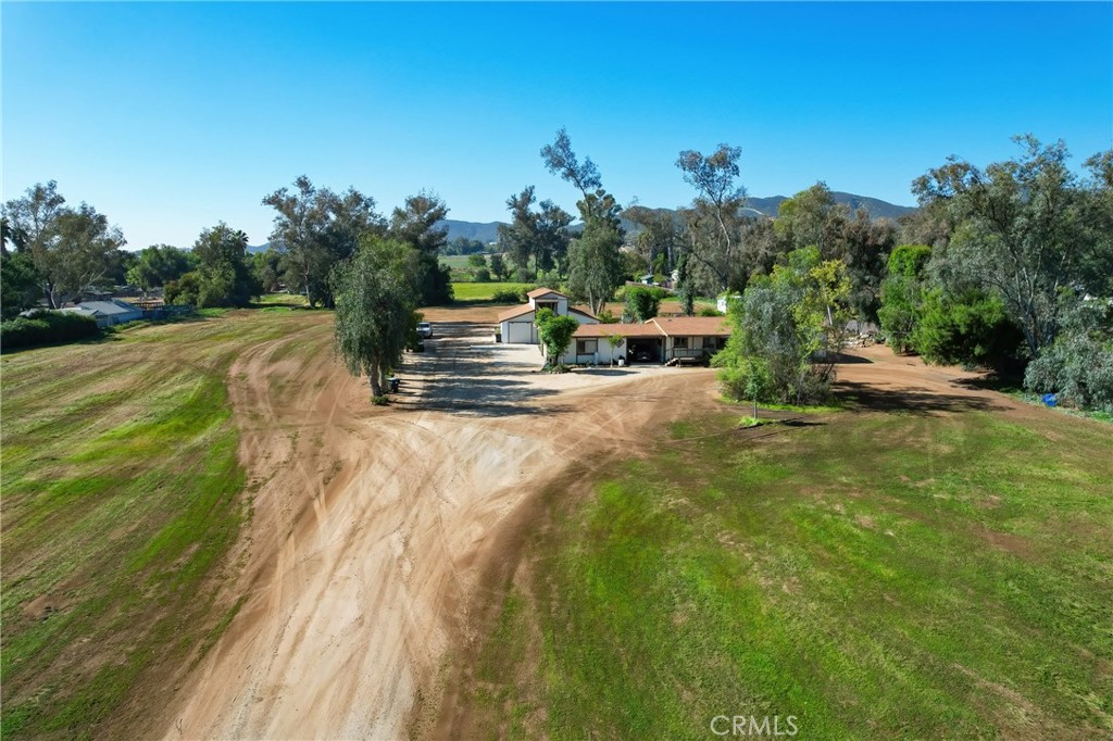 27355 Scott Road Menifee, CA 92584 - Photo 9 of 16 a view of a swimming pool with a yard