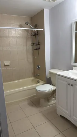 a bathroom with a toilet a sink and bathtub