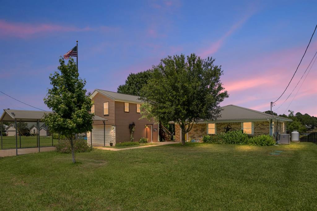 227 Scenic Road Trinidad, TX 75163 - Photo 1 of 40 a front view of a house with a garden