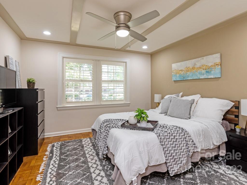 100 Colville Road, Unit 61A Charlotte, NC 28207 - Photo 11 of 15 a bedroom with a bed and a lamp
