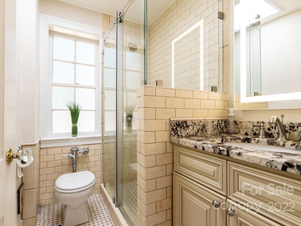 100 Colville Road, Unit 61A Charlotte, NC 28207 - Photo 14 of 15 a bathroom with a sink toilet and shower