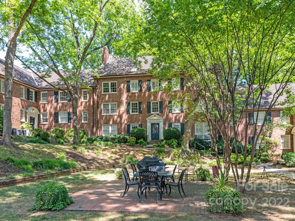 100 Colville Road, Unit 61A Charlotte, NC 28207 - Photo 15 of 15 a view of a patio with table and chairs and potted plants