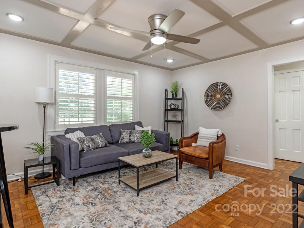 100 Colville Road, Unit 61A Charlotte, NC 28207 - Photo 4 of 15 a living room with furniture and a window