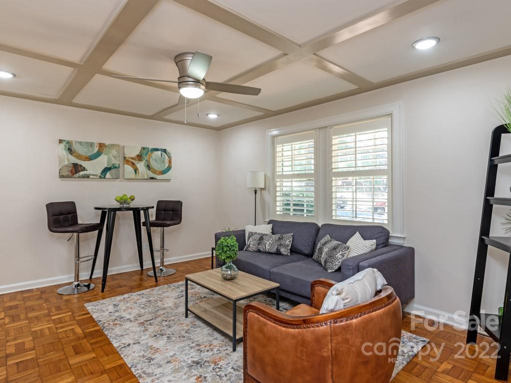 100 Colville Road, Unit 61A Charlotte, NC 28207 - Photo 5 of 15 a living room with furniture and a rug