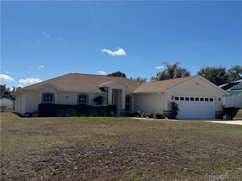 4588 East Van Ness Road Inverness, FL 34453 - Photo 33 of 34 a front view of a house with a yard