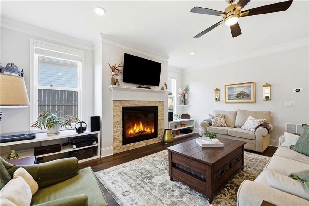 328 McQueen Way Canton, GA 30115 - Photo 14 of 66 a living room with furniture a flat screen tv and a fireplace