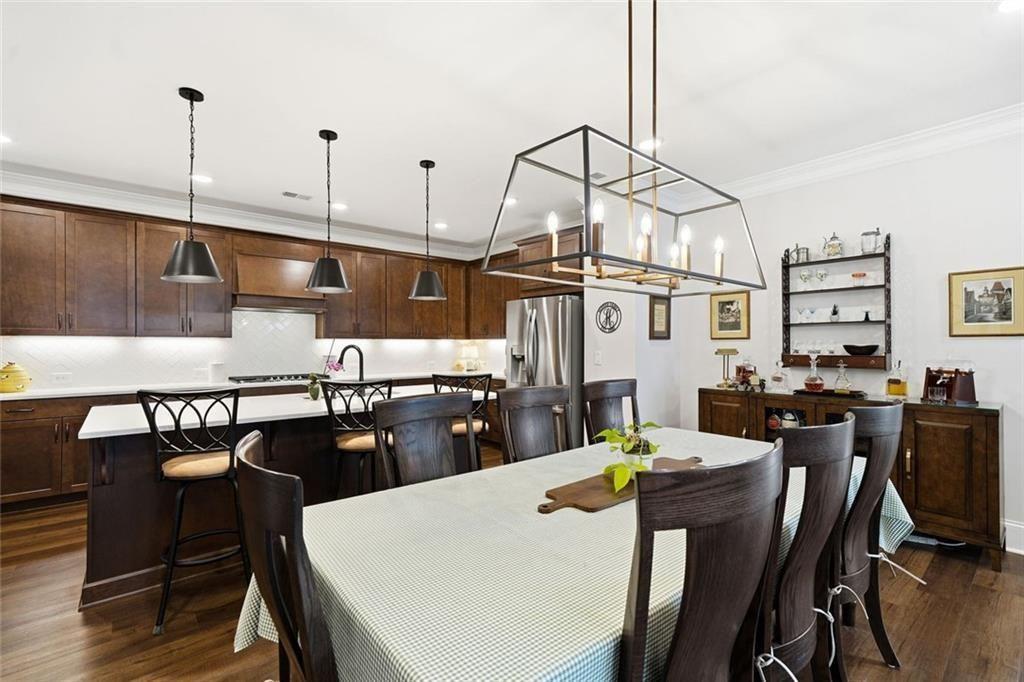 328 McQueen Way Canton, GA 30115 - Photo 20 of 66 a view of a dining room with furniture