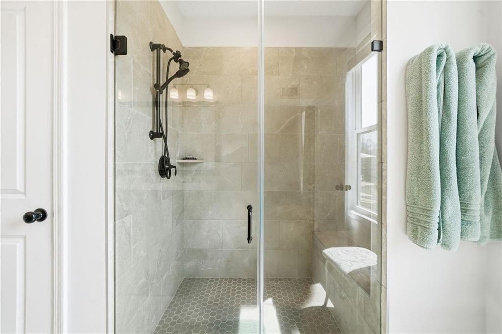 328 McQueen Way Canton, GA 30115 - Photo 30 of 66 a bathroom with a shower