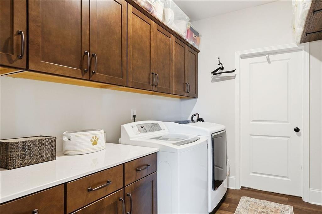 328 McQueen Way Canton, GA 30115 - Photo 33 of 66 a utility room with dryer and washer