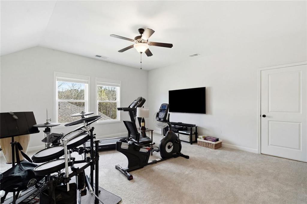 328 McQueen Way Canton, GA 30115 - Photo 37 of 66 a view of a livingroom with workspace and a window