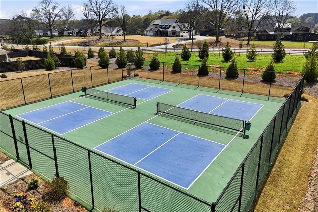 328 McQueen Way Canton, GA 30115 - Photo 61 of 66 a view of a tennis ground with furniture and a lake view