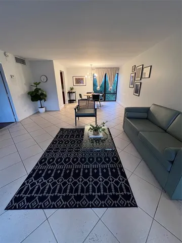 a living room with rug