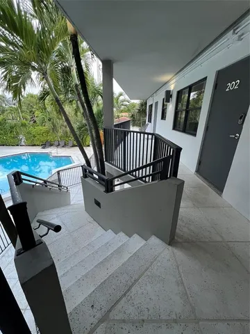a view of balcony with furniture