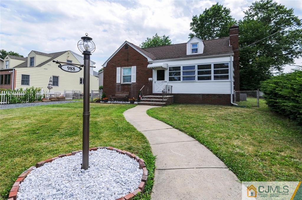 988 Clark Road North Brunswick, NJ 08902 - Photo 1 of 25 a front view of a house with garden