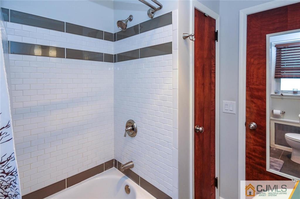 988 Clark Road North Brunswick, NJ 08902 - Photo 16 of 25 a bathroom with a shower and a sink