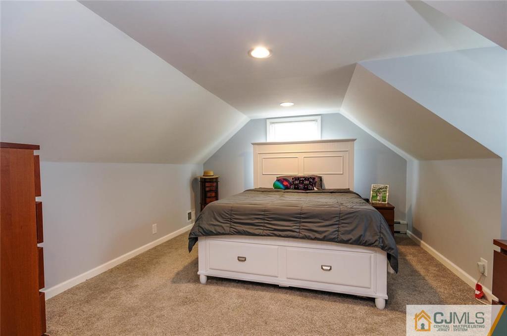 988 Clark Road North Brunswick, NJ 08902 - Photo 17 of 25 a bedroom with a bed and a window