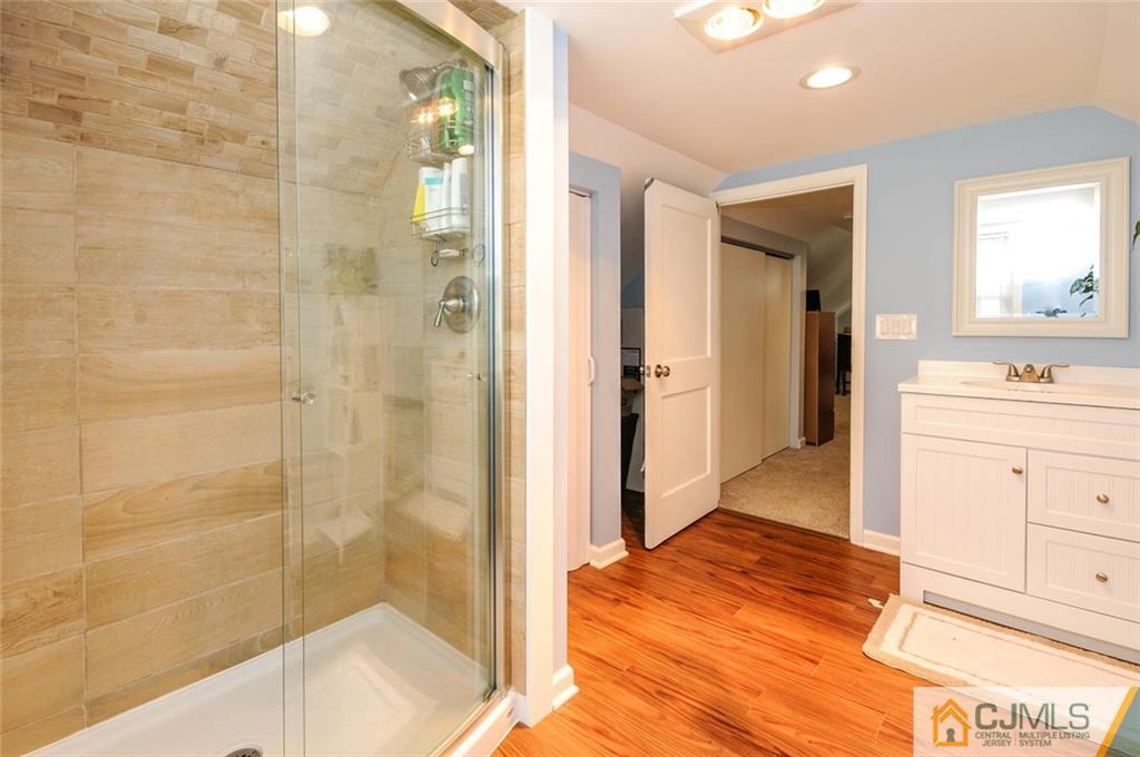 988 Clark Road North Brunswick, NJ 08902 - Photo 20 of 25 a bathroom with a sink and a shower