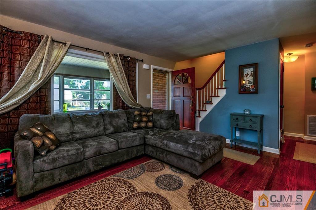 988 Clark Road North Brunswick, NJ 08902 - Photo 3 of 25 a living room with furniture and a window