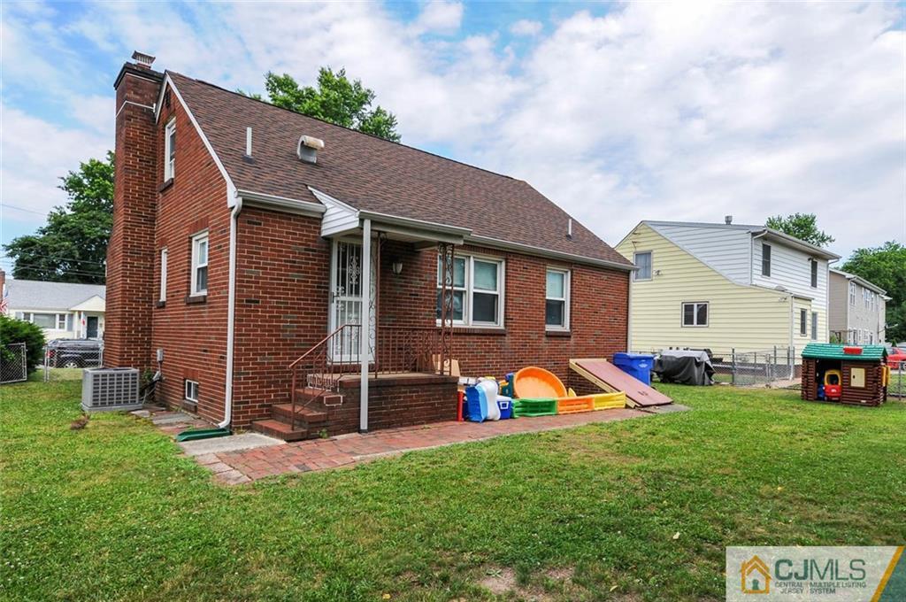 988 Clark Road North Brunswick, NJ 08902 - Photo 22 of 25 a view of a house with a backyard porch and sitting area