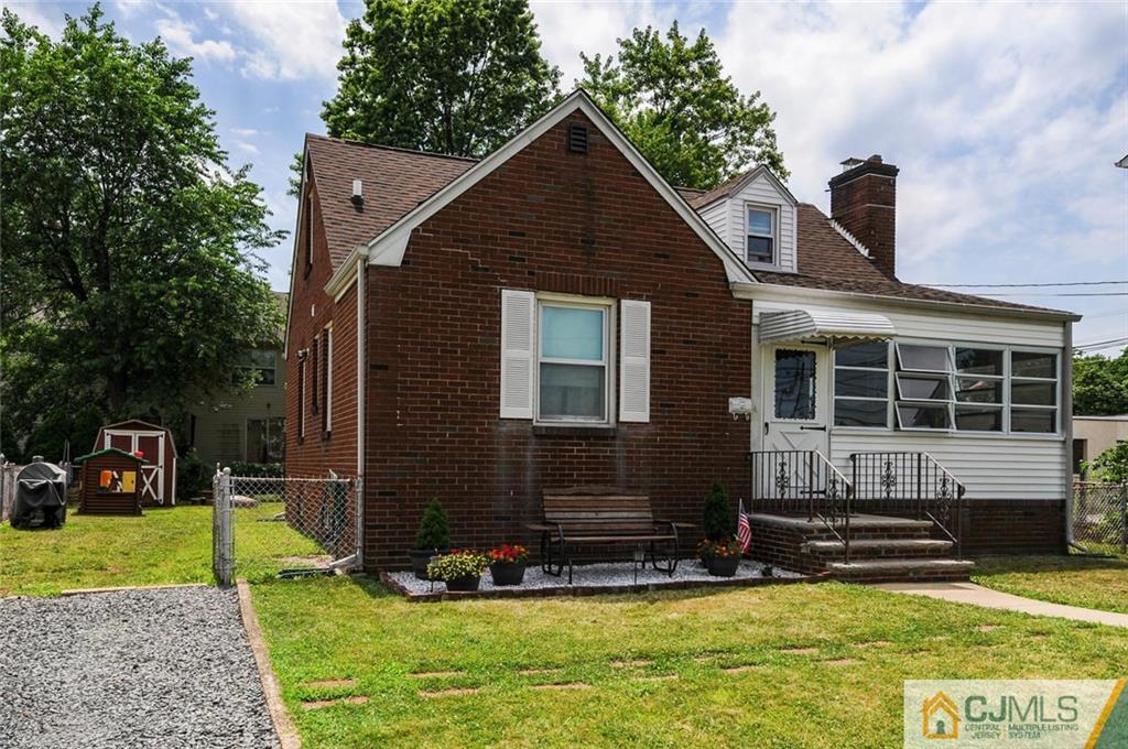 988 Clark Road North Brunswick, NJ 08902 - Photo 23 of 25 a front view of a house with a yard