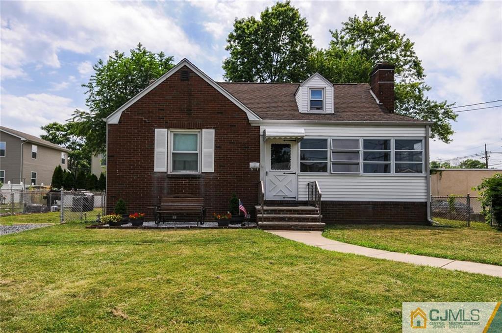 988 Clark Road North Brunswick, NJ 08902 - Photo 24 of 25 a front view of a house with a yard