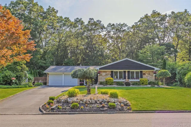 a front view of a house with swimming pool having outdoor seating