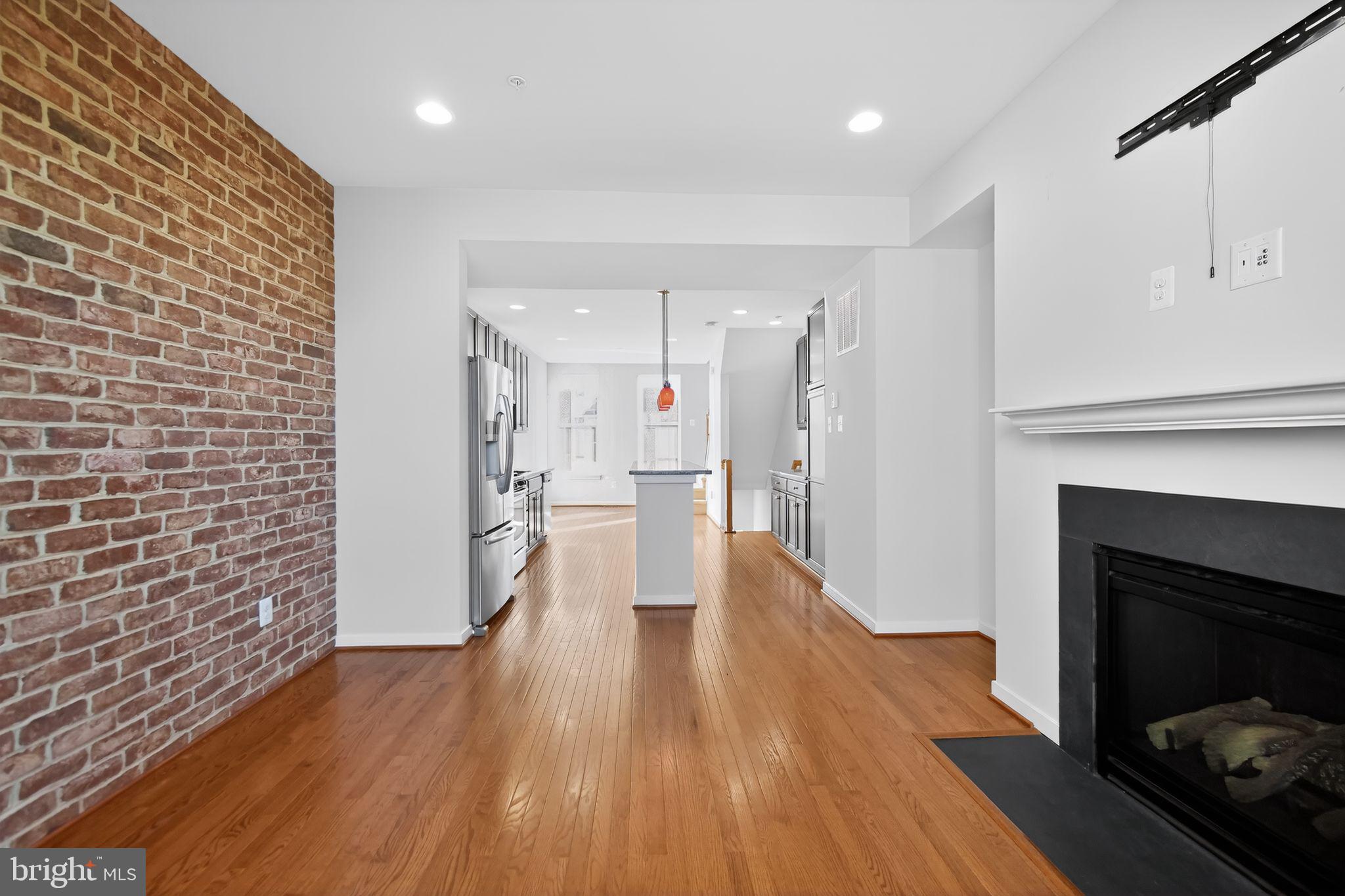 1415 Trafalgar Lane Frederick, MD 21701 - Photo 8 of 30 Fire place and island