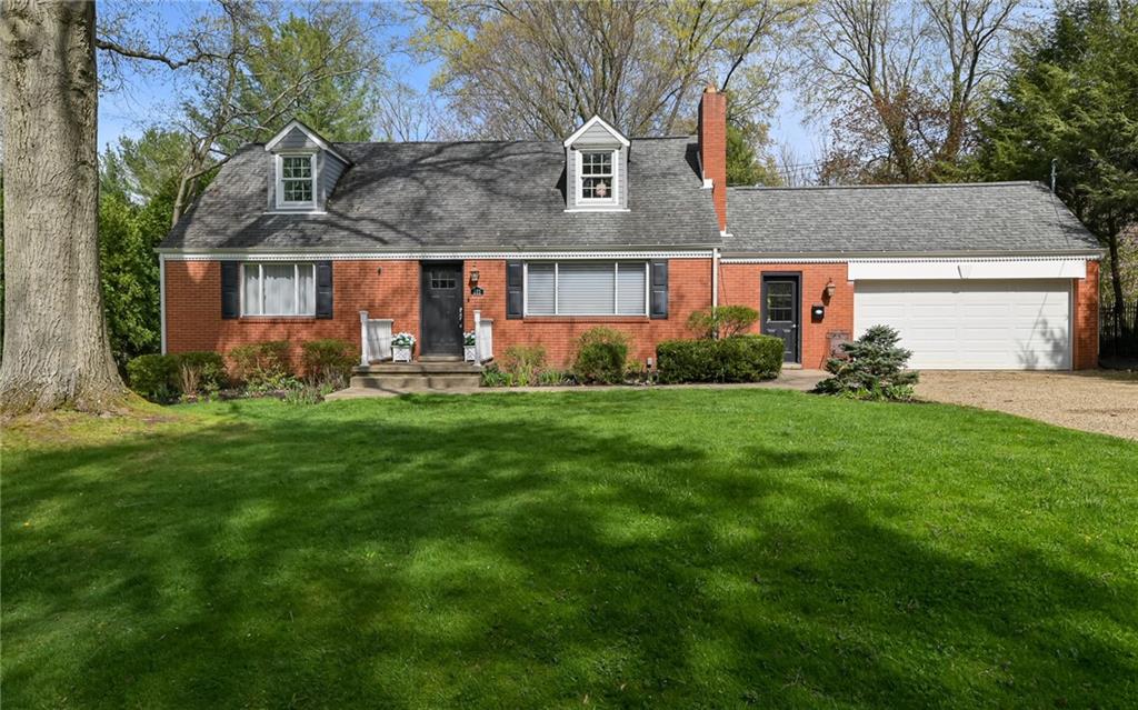 a view of house with a yard