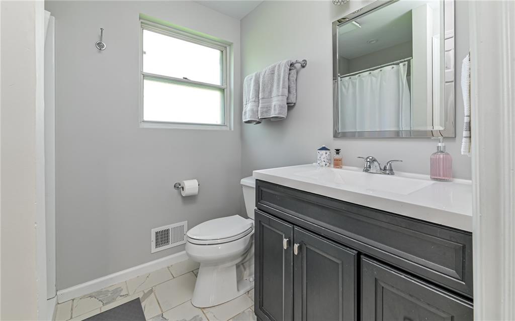 511 Chestnut Road Sewickley, PA 15143 - Photo 12 of 25 a bathroom with a sink toilet and vanity