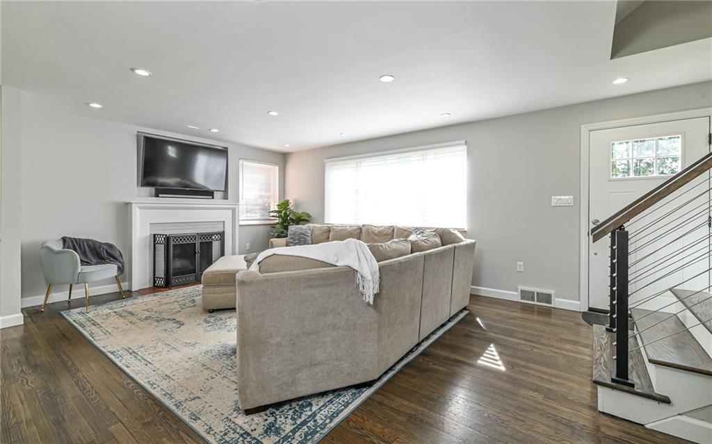 511 Chestnut Road Sewickley, PA 15143 - Photo 6 of 25 a living room with furniture fireplace and flat screen tv