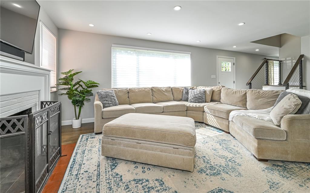 511 Chestnut Road Sewickley, PA 15143 - Photo 7 of 25 a living room with furniture and a fireplace