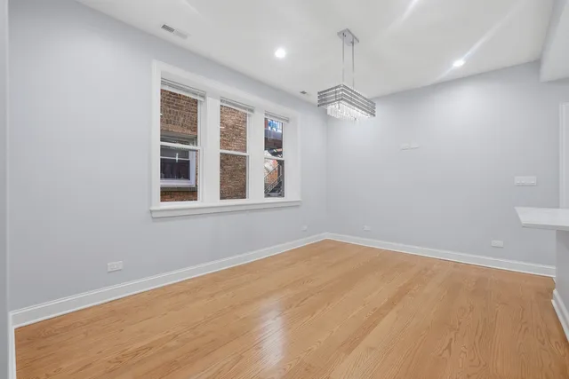 a view of empty room with windows