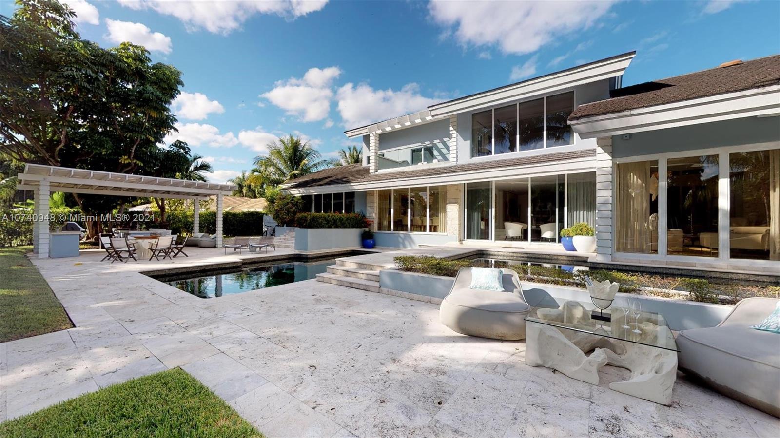 700 Lake Road Miami, FL 33137 - Photo 6 of 10 a view of a house with swimming pool and sitting area