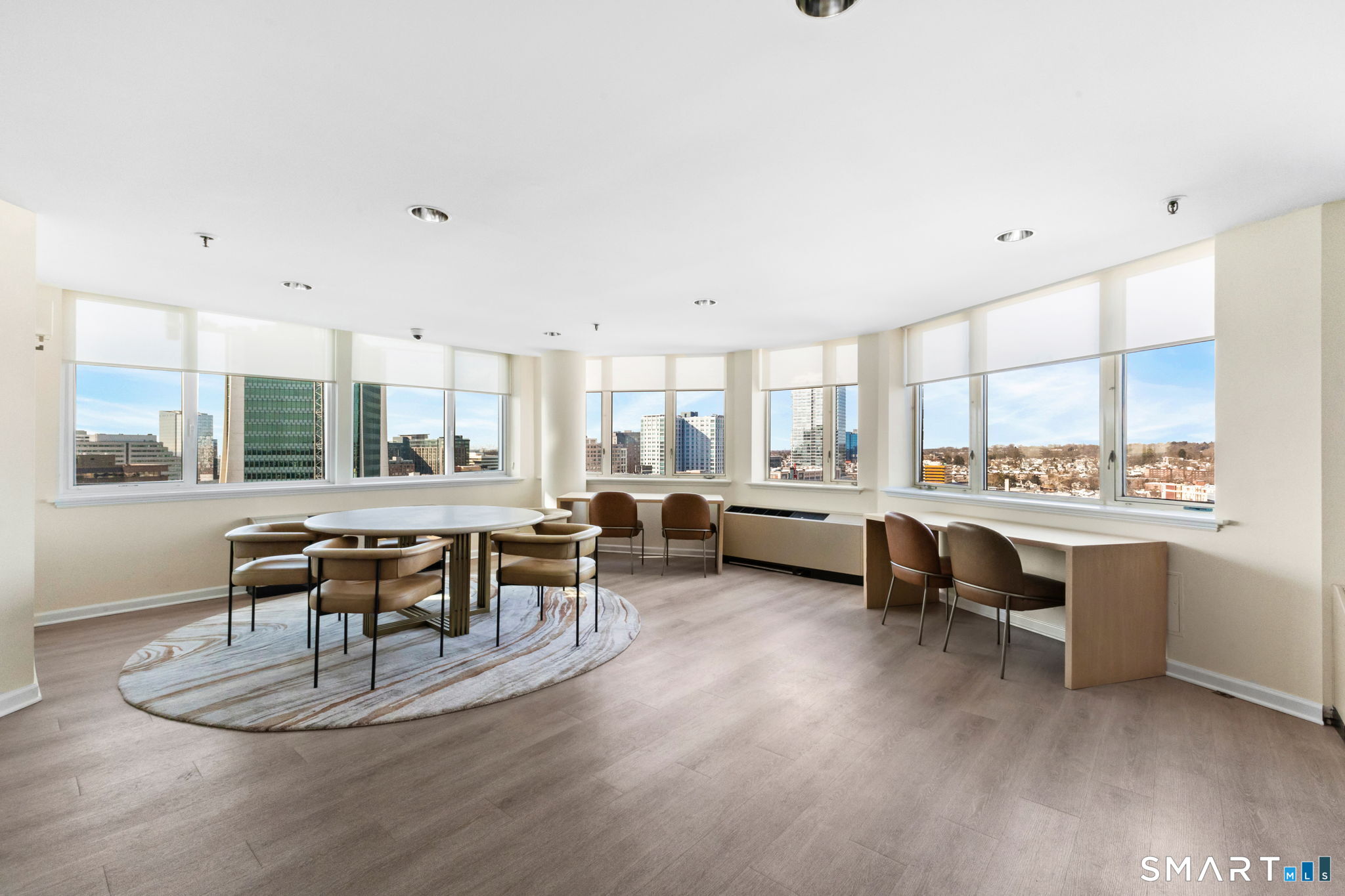25 Forest Street, Unit 7D Stamford, CT 06901 - Photo 25 of 33 a living room with furniture a dining table and kitchen view
