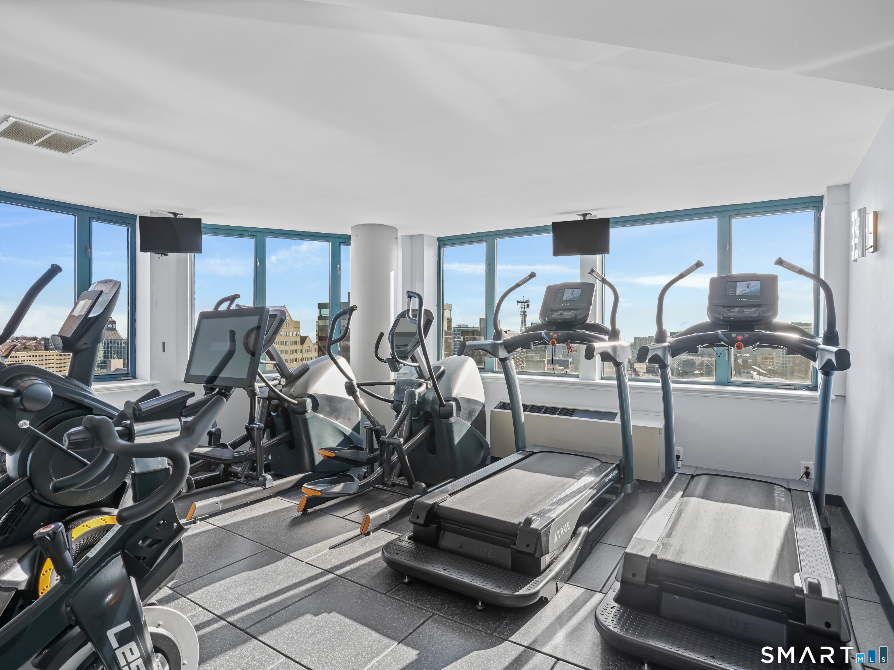 25 Forest Street, Unit 7D Stamford, CT 06901 - Photo 26 of 33 a room with gym equipment and wooden floor