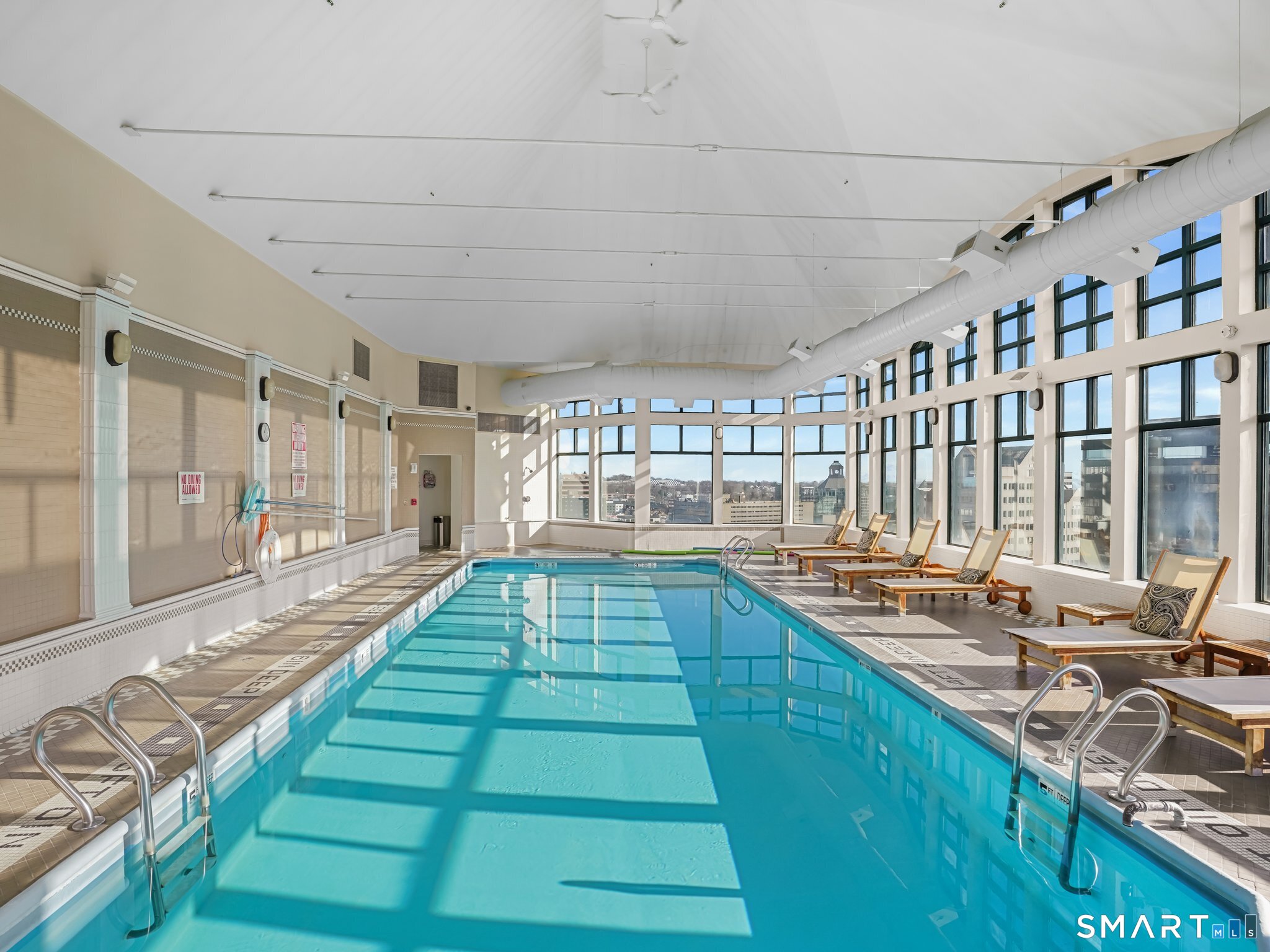 25 Forest Street, Unit 7D Stamford, CT 06901 - Photo 28 of 33 a large kitchen with lots of counter space and windows