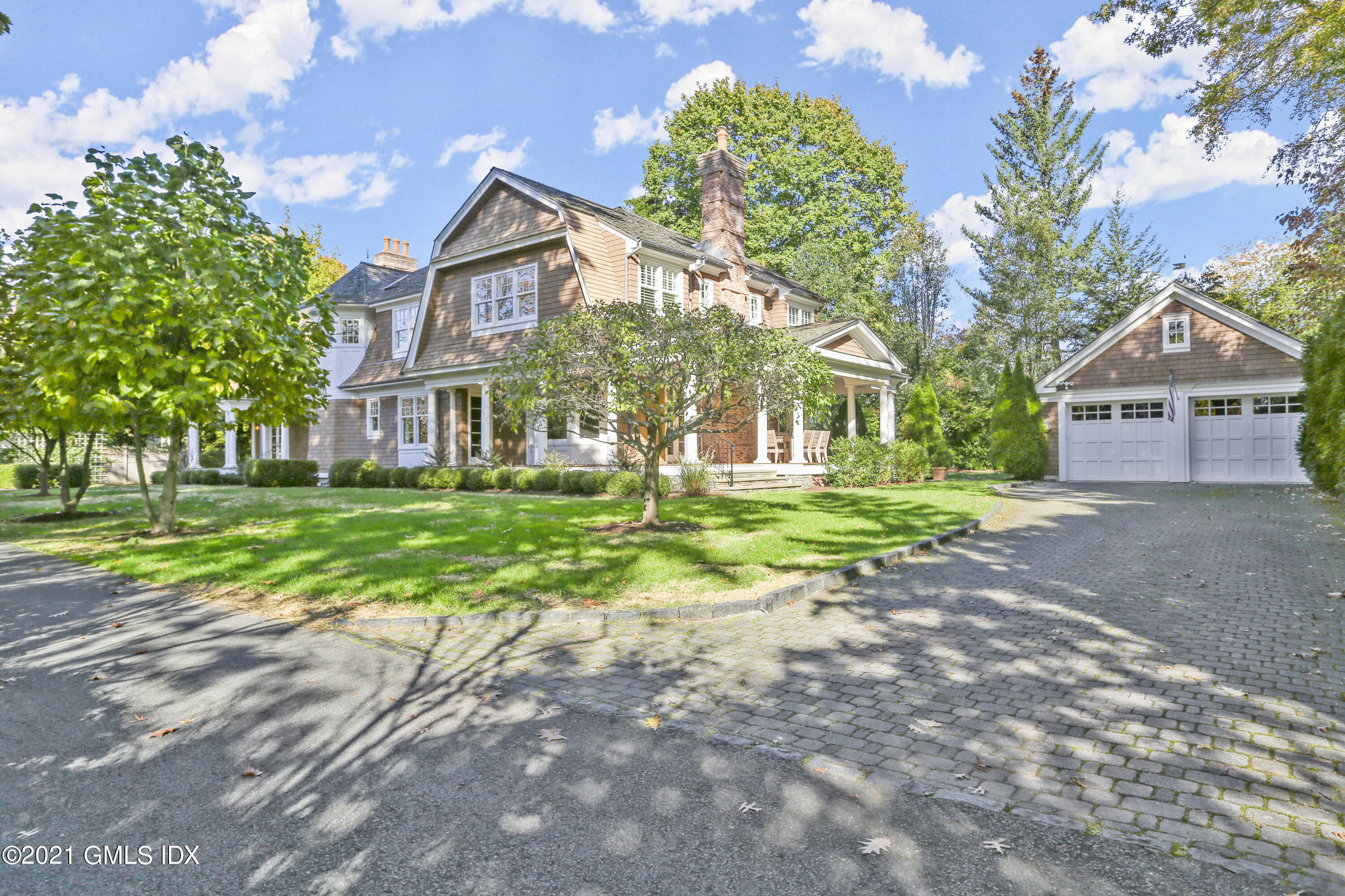 222 Riverside Avenue Riverside, CT 06878 - Photo 3 of 61 a front view of house with yard and green space