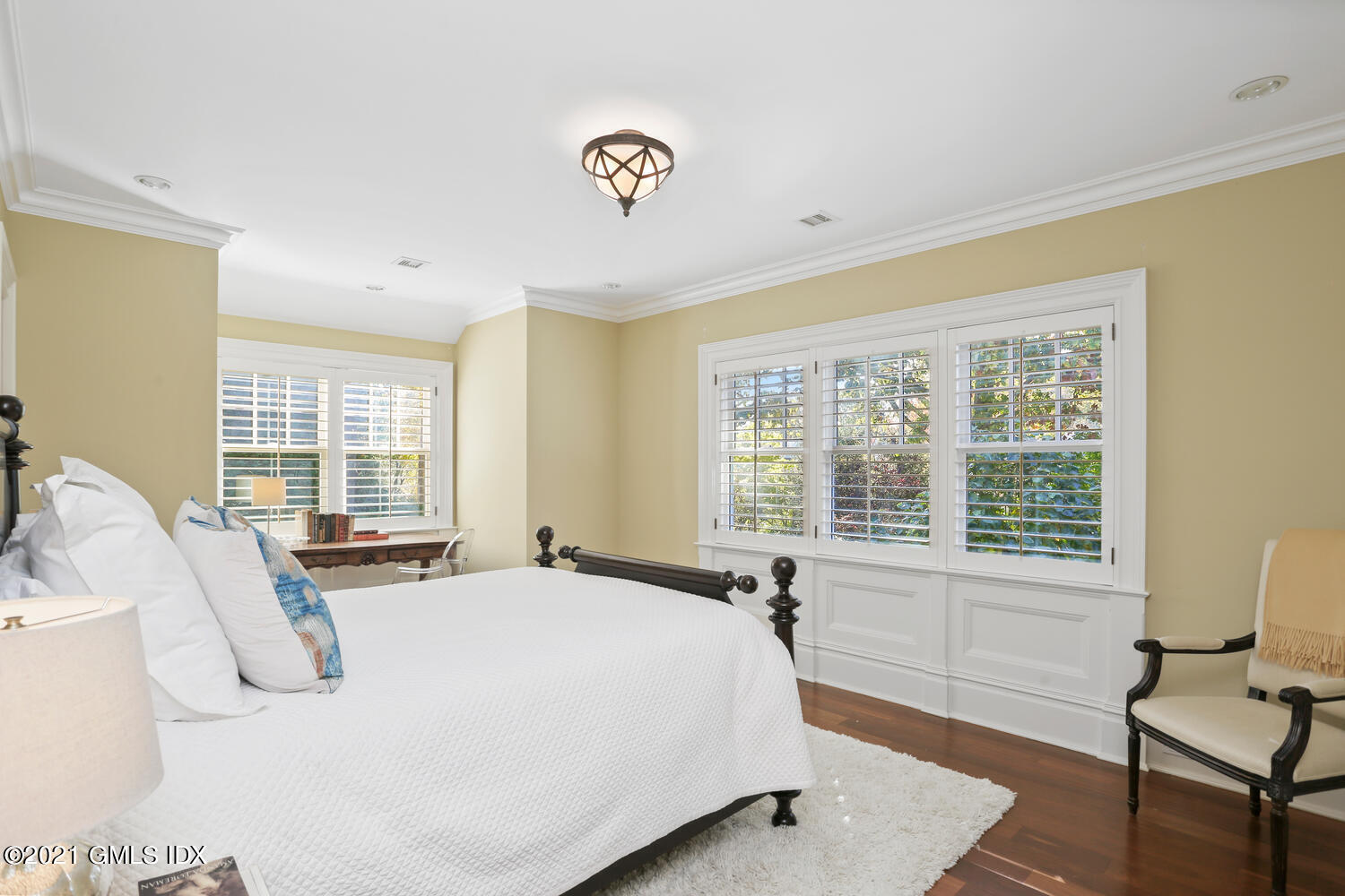 222 Riverside Avenue Riverside, CT 06878 - Photo 39 of 61 a spacious bedroom with a bed and a large window